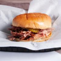 Pork Sandwich · Low and slow, hickory-smoked, hand-pulled pork on a toasted bun with pickles.
