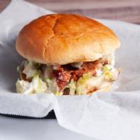 Cadillac Chicken · Our award-winning pulled chicken topped with sweet sauce, bacon, jack cheese, lettuce, pickl...