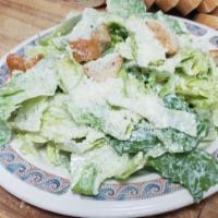 Caesar · Fresh romaine, rigatti's caesar dressing, anchovy, croutons and Parmesan cheese.