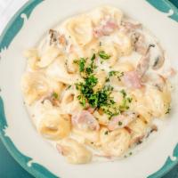 Cheese Tortellini · With mushrooms and ham in an alfredo sauce.