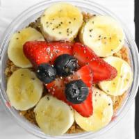 Acai Bowl · Our acai fruit blend, topped with bananas, sunrise granola, and a mango drizzle.