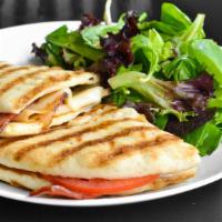 Turkey Club Panini · We took the great flavors of a turkey club to create this masterpiece of roasted turkey, Swi...