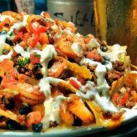 Shrimp & Chorizo Nachos. · Grilled shrimp and chorizo topped with corn, black beans, jack and cheddar cheese, pico and ...