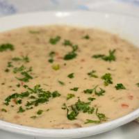 New England Clam Chowder · Homemade cream-based chowder served with tender clams and potatoes. Contains bacon.