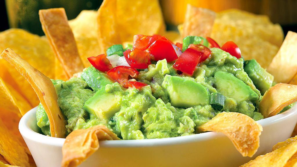 Jose'S Guacamole · Made with fresh avocados, lime juice, tomatoes and cilantro, served with tortilla chips.