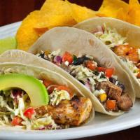 Mix & Match (3 Tacos) · All tacos finished with our ensenada slaw, pico de gallo, Mexican cheese and served with chi...