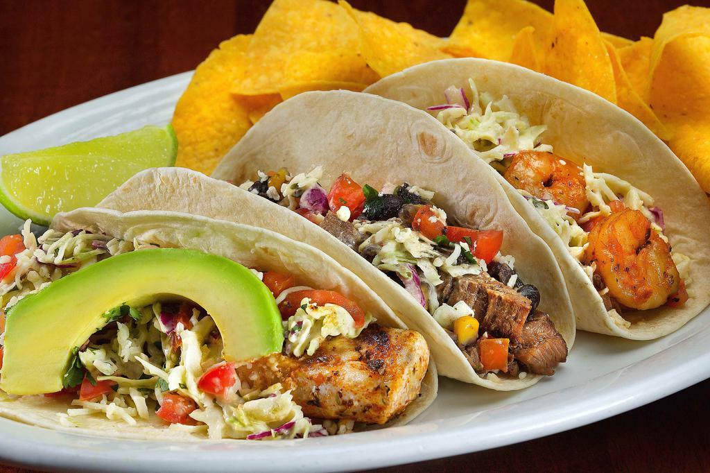 Mix & Match (3 Tacos) · All tacos finished with our ensenada slaw, pico de gallo, Mexican cheese and served with chips.