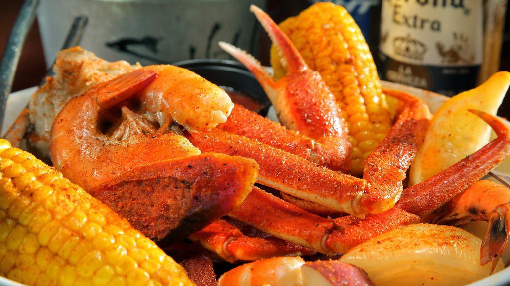 Beach Boil · Shrimp, snow crab legs, sausage, corn, onions and potatoes served in our seasoned boil.