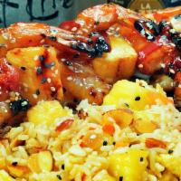 Shrimp Brochette · Large shrimp wrapped in applewood bacon, skewered with pineapples, grilled and glazed with H...