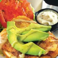 Boca Style Grouper Sandwich · Breaded and pan-sautéed grouper topped with fresh avocado, tomatoes and lettuce. Finished wi...