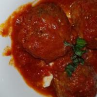 Meatballs · Served over ricotta cheese and topped with pomodoro sauce.