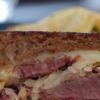 Grilled Reuben · Corned beef, melted swiss, sauerkraut and 1000 island dressing on grilled rye bread.