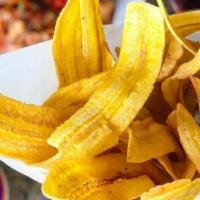 Mariquitas · Hand cut plantain chips served with garlic mojo sauce.