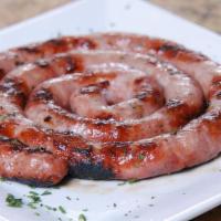 Salchicha Parrillera · Grilled thin Argentine style sausage (very tasty!).