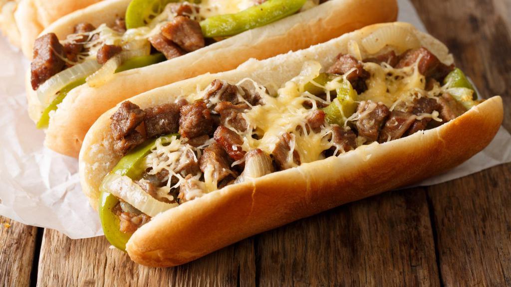 Famous Philly Cheesesteak A La Carte · Prime thinly sliced us beef is cooked to perfection and served on a hot oven-toasted roll. With mushrooms, green peppers, onions, and mozzarella cheese.