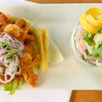 The Achorado · A combination of ceviche with fried seafood served with fries cassava, corn and sweet potato...