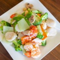 Seafood Deluxe · Lobster meat, jumbo shrimp, scallop, crabmeat and squid sautéed with assorted vegetable in w...