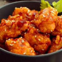Sesame Chicken · Crispy chicken wok-tossed in sevary sweet sauce, topped with sesame seeds.