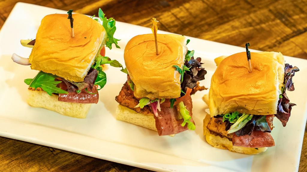 Salmon Sliders · With mixed greens, red onions, tomatoes, and chipotle aioli, topped with turkey bacon.