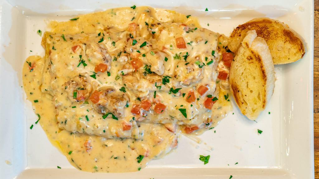 Seafood Lasagna · With salmon, scallops, and shrimp, covered in a smoked gouda cream sauce.
