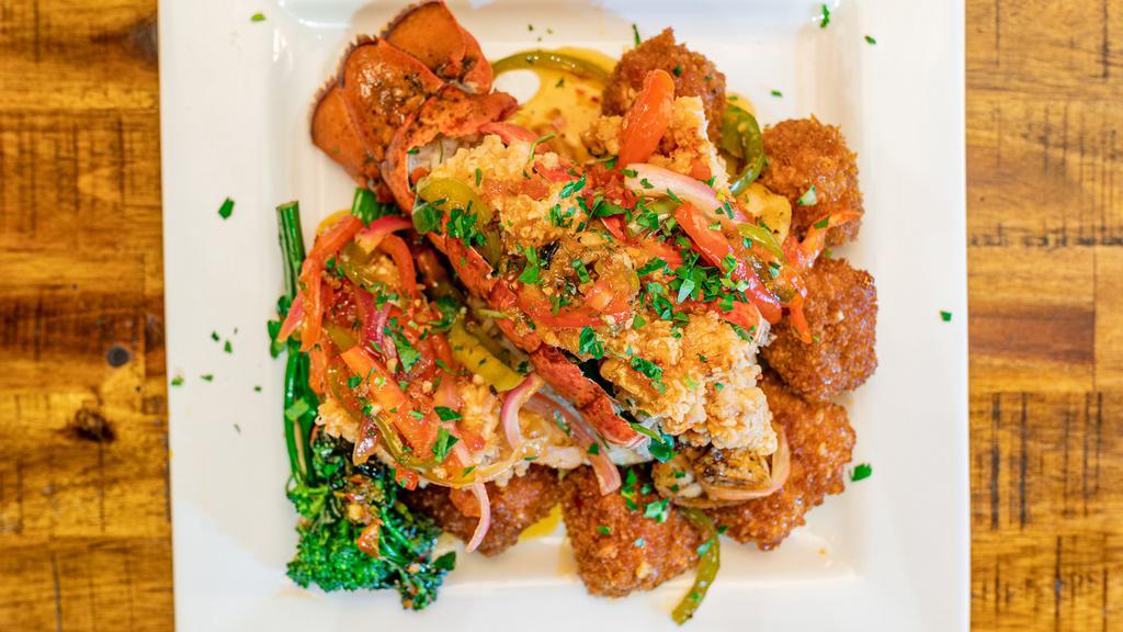 Sweet & Spicy Seafood Trio · Fried lobster, shrimp, and salmon bites served over rice with peppers and broccolini.
