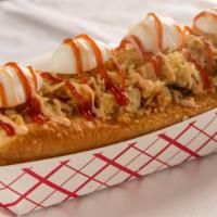 Super Perro Toci- Hot Dog · Big ho dog with bacon and quail eggs. Includes mozzarella cheese, home-made sauce and crushe...