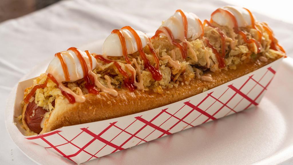 Super Perro Toci- Hot Dog · Big ho dog with bacon and quail eggs. Includes mozzarella cheese, home-made sauce and crushed potato chips.