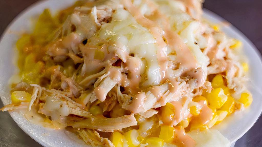 Maicito De Pollo · Corn and shredded chicken. Sweet grated corn kernels. Includes mozzarella cheese, pink sauce and crushed potato chips.