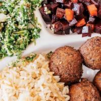 Falafel Platter · Crispy fried chickpea fritters with choice of two or three sides, fresh pita bread, and sauc...