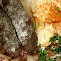 Kafta Platter · Seasoned ground beef kebab with choice of two or three sides, fresh pita bread, and sauce of...