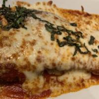 Veal Parmigiana · Breaded veal cutlets mozzarella cheese tomato sauce. served with a side order of pasta garli...
