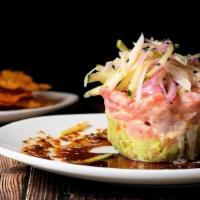 Ahi Tuna Stack · Zesty ahi tuna served atop cucumber and guacamole, topped with jicama slaw & soy ginger sauc...