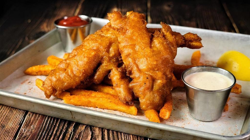 Fish N' Chips · Beer battered Grouper served on a bed of fries and Tartar sauce