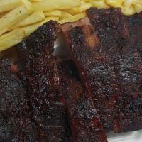 Baby Back Ribs · 1/2 rack hickory smoked tender baby back ribs.