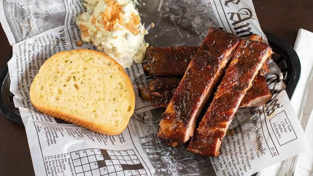 Holy Ribs · Rack of four smoked bbq ribs with sauce of your choice and side of potato salad, Texas toasts.