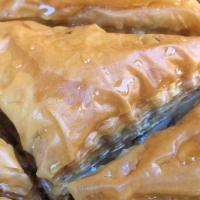 Baklava · Tradition honey-soaked filo dough filled with walnuts and almonds