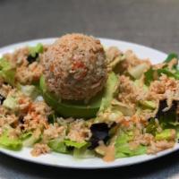 Avocado Crab Salad · avocado filled with imitation crab salad, mixed greens, salsa golf dressing.