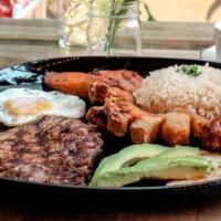Bandeja Paisa · A typical Colombian dish with carne asada, crispy pork belly, fried egg, white rice, red bea...
