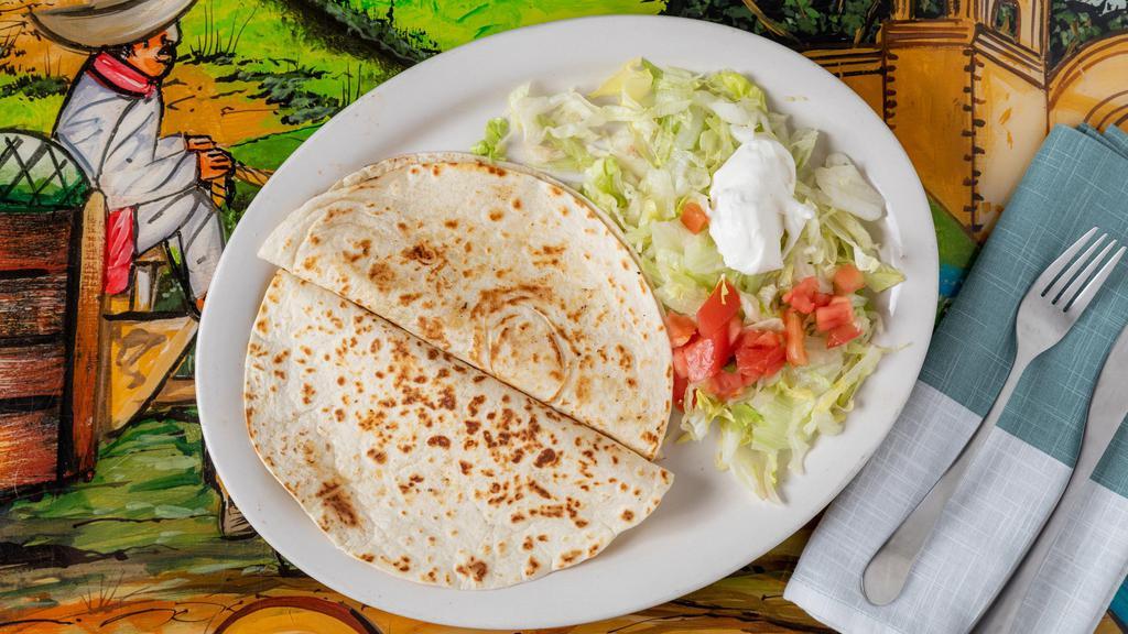 Quesadillas · Pan-seared flour tortilla folded with filled with cheese and onions, chicken, shredded beef, or shrimp.