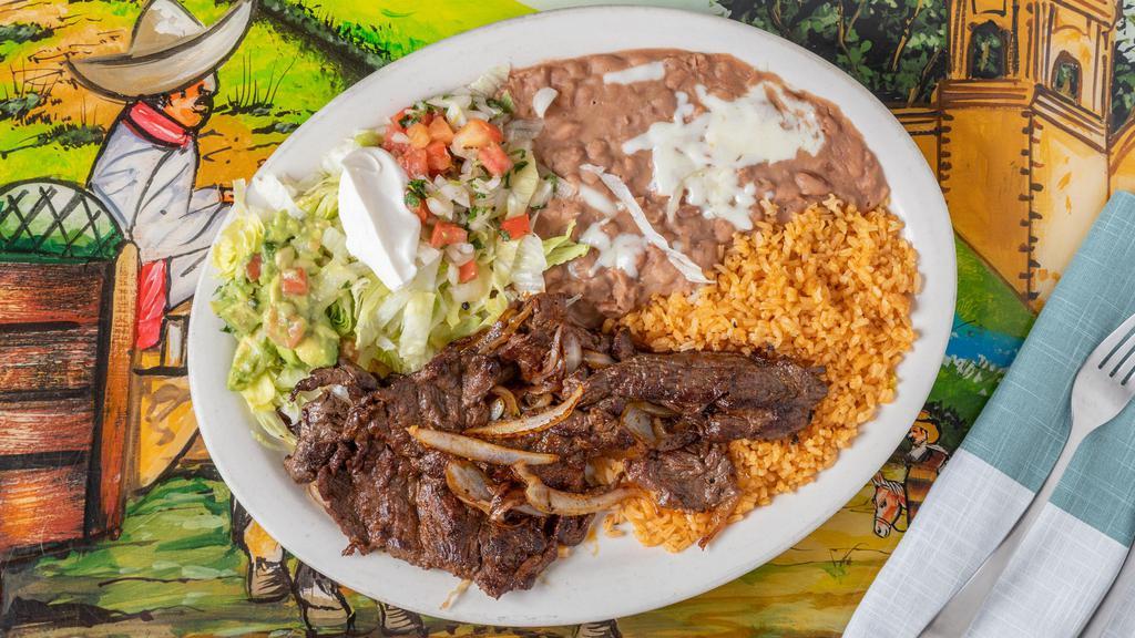 Carne Asada · A thin sliced steak seasoned and cooked to perfection.