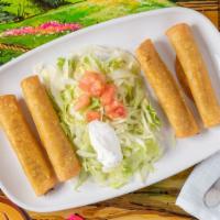 Flautas Doradas · Four crispy taquitos with your choice of chicken or beef, served with a side salad.
