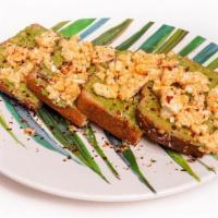 Spicy Guac Toast · House Guacamole on toasted Whole Wheat Bread topped Olive Oil, Spicy Feta Cheese, Salt & Pep...