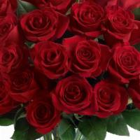 Love & Devotion - Long Stemmed Red Roses · The spectacular bouquet features two dozen red roses accented with salal. Approximately 15