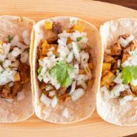 Tacos Al Pastor · Tacos al pastor is a dish which is prepared from 24 hour marinated (in a variety of dried ch...