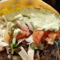 Arepa Beef · Beef, cilantro sauce, pico de gallo, white cheese