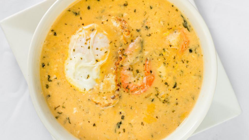 Chupe De Pescado O Camarones · Shrimp fish & vegetable soup with milk.