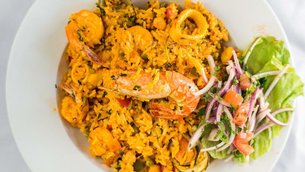 Arroz Con Mariscos · Rice with seasoned shrimp, octopus & squid with salsa criolla.