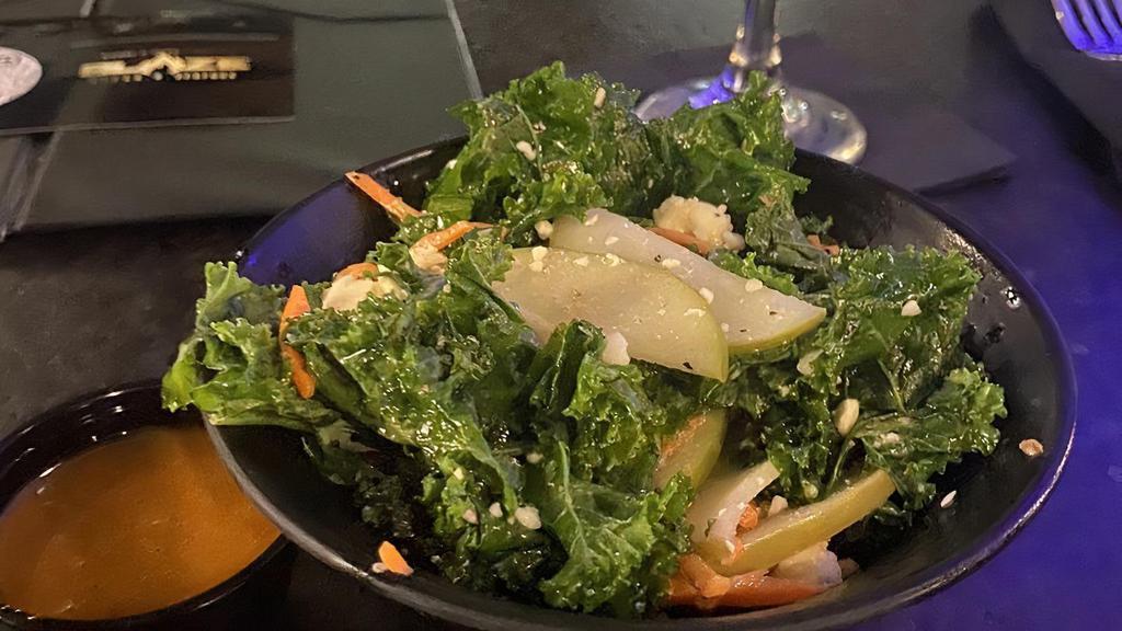 Kale Salad · crispy young kale and tossed in apple vinaigrette with candied pecans.