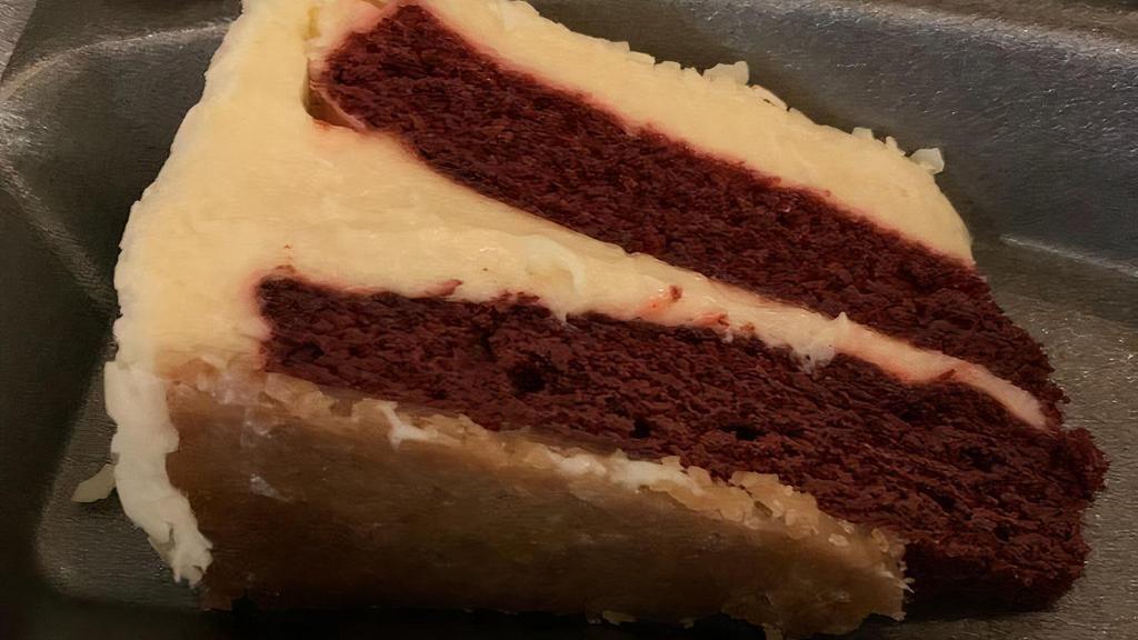Red Velvet Cheesecake	 · Rice red velvet cake nestled between layers of cheesecake.