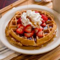 Waffle · Waffle with fresh strawberries and whipped cream.